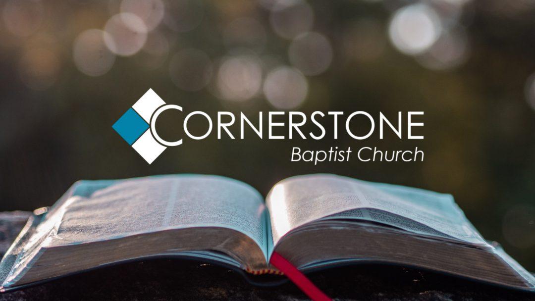 Cornerstone Baptist Church logo with open Bible on outdoor table
