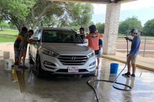 Youth washing a car
