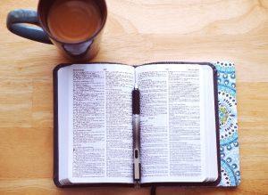 Open Bible and coffee cup